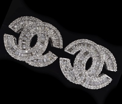 Lot 32 - Pair of diamond set entwined back-to-back double C diamond earrings