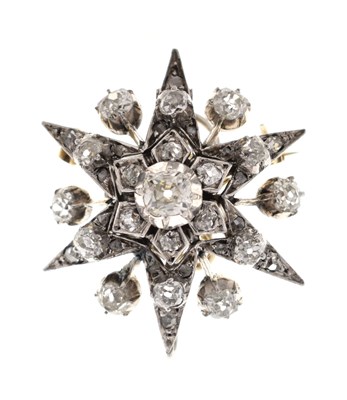 Lot 18 - Early 20th century diamond yellow and white metal starburst pendant brooch