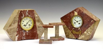 Lot 409 - French Art Deco rouge marble mantel clock garniture