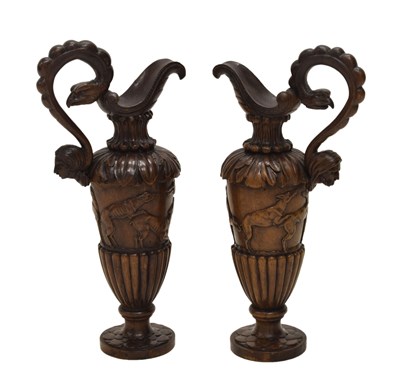 Lot 172 - Pair of 19th century Italian carved walnut sealed ewers