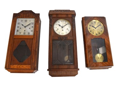 Lot 461 - Three early 20th Century oak-cased wall clocks