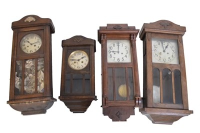 Lot 458 - Four assorted early 20th Century oak wall clocks