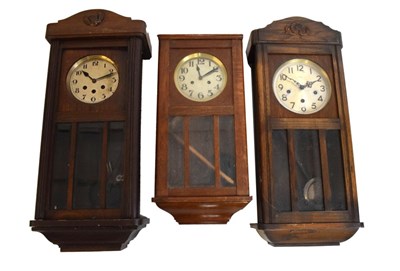 Lot 460 - Three early 20th Century oak wall clocks