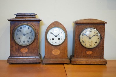 Lot 414 - Three early 20th Century oak-cased mantel clocks