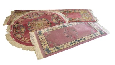 Lot 630 - Three pink  Chinese wool rugs