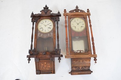 Lot 323 - Two late 19th Century American inlaid walnut wall clocks