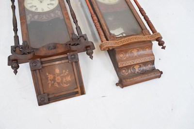 Lot 323 - Two late 19th Century American inlaid walnut wall clocks