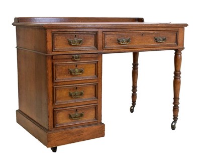 Lot 523 - Hobbs & Co oak desk or library table