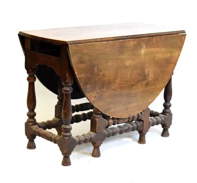 Lot 447 - 18th Century style oak gate-leg table