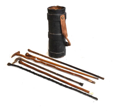 Lot 514 - Group of assorted sticks and munitions shell case