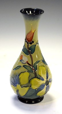 Lot 219 - Moorcroft - 'Hypericum' pattern bud vase tube lined with yellow flowers