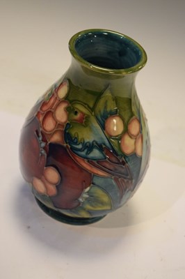 Lot 218 - Moorcroft - 'Finches' pattern baluster vase tube lined with pomegranate, berries and birds