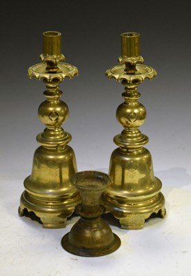 Lot 330 - Pair of Chinese polished bronze bell-shape candlesticks