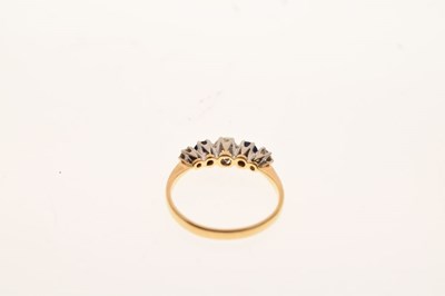 Lot 22 - Graduated five stone diamond and sapphire ring