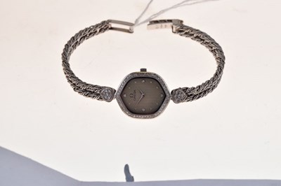 Lot 148 - Omega - Lady's 18ct white gold, diamond set quartz bracelet watch