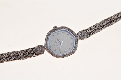 Lot 148 - Omega - Lady's 18ct white gold, diamond set quartz bracelet watch