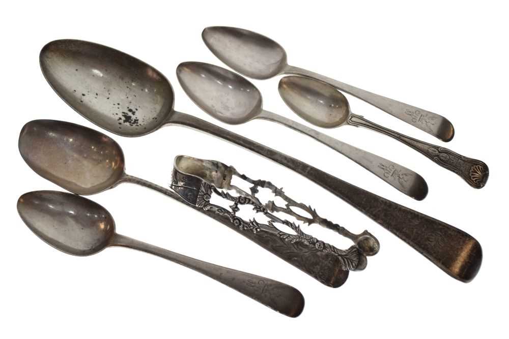 Lot 127 - Silver basting spoon, four dessert spoons, etc