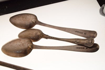 Lot 127 - Silver basting spoon, four dessert spoons, etc