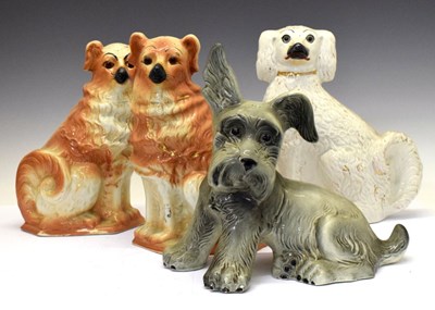 Lot 445 - Three Staffordshire dogs and one other