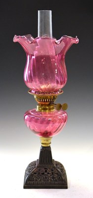 Lot 243 - Cranberry oil lamp