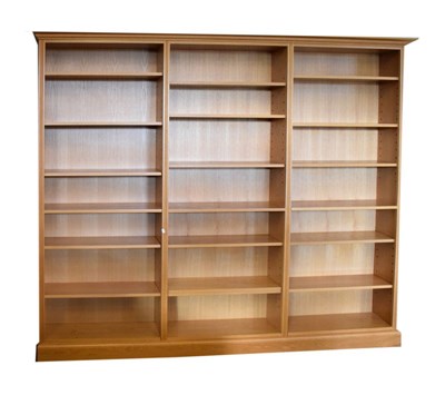 Lot 693 - Modern light oak three-section bookcase