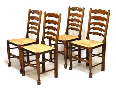 Lot 578 - Four ladder-back rush seated dining chairs