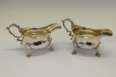 Lot 163 - Pair of George II silver sauce boats