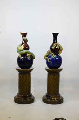 Lot 405 - Pair of Burmantofts dragon double gourd vases on pedestal bases
