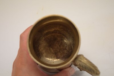 Lot 146 - George III silver mug of baluster form with leaf mounted scroll handle