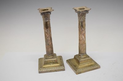 Lot 198 - Pair of George V silver column candlesticks