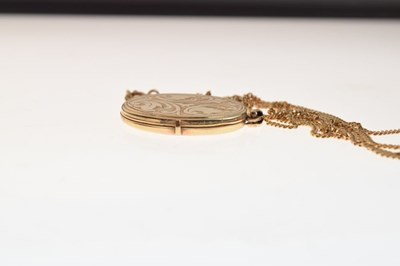 Lot 54 - 9ct gold oval locket and chain