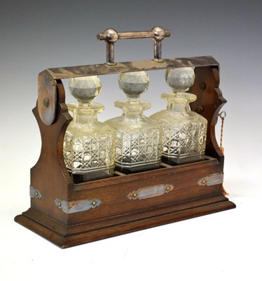 Lot 347 - Oak-framed three bottle tantalus