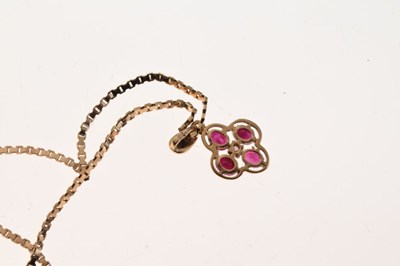 Lot 55 - 9ct gold, ruby and diamond quatrefoil pendant on a 9ct chain