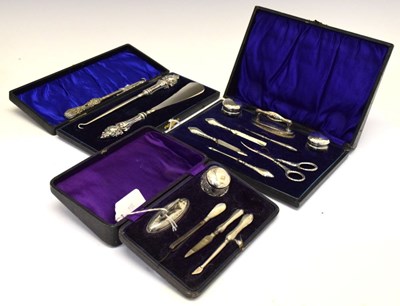 Lot 181 - Three cased sets and part sets of silver-mounted dressing requisites, etc