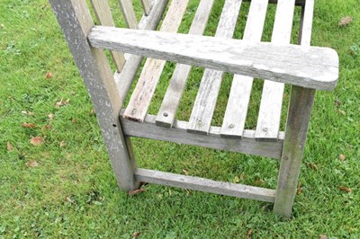 Lot 753 - Teak two seater garden bench of slatted design