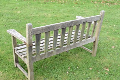 Lot 753 - Teak two seater garden bench of slatted design