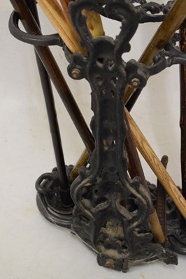 Lot 686 - Cast metal stick stand with assorted sticks