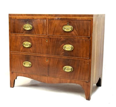 Lot 585 - Late George III mahogany chest