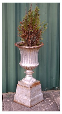 Lot 619 - Silver painted cast iron garden urn and pedestal