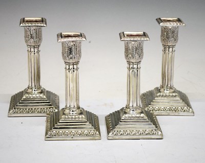 Lot 363 - Set of four silver-plated table candlesticks