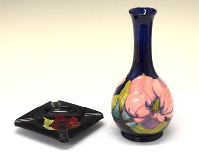 Lot 462 - Moorcroft pottery-'Magnolia' pattern baluster vase together with a 'Hibiscus' pattern ashtray