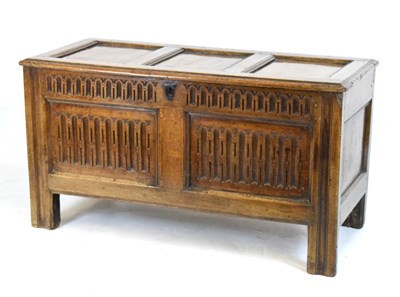 Lot 607 - Oak cover with later carved front panels