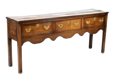 Lot 604 - Late Georgian low dresser with three drawers