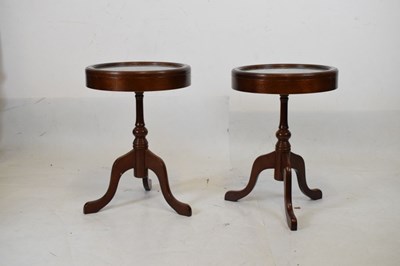 Lot 729 - Pair of circular tripod vitrine tables