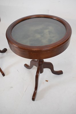 Lot 729 - Pair of circular tripod vitrine tables