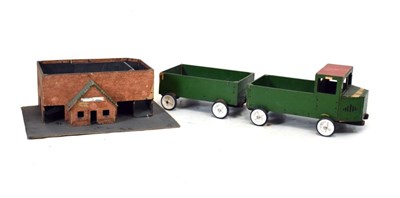 Lot 425 - Mid Century painted toy lorry, trailer and garage