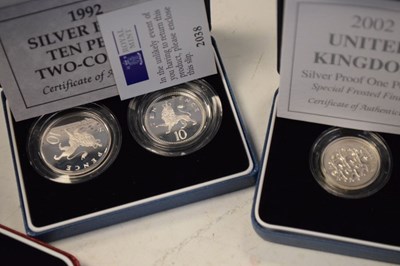 Lot 129 - Seven Royal Mint commemorative silver proof coins in presentation cases