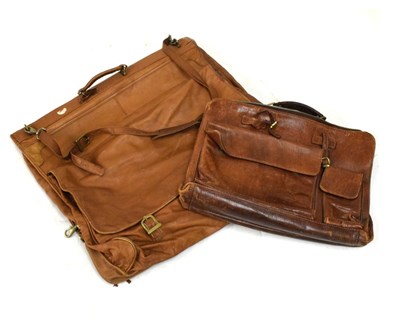 Lot 568 - Brown leather suit bag and satchel