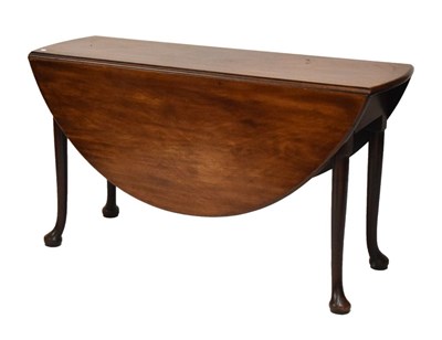 Lot 580 - George III mahogany pad foot oval drop-leaf dining table