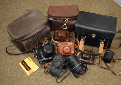 Lot 658 - Quantity of vintage cameras, to include so lenses, etc